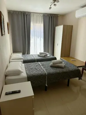 Cama o camas de una habitación en Royal Inn Aparthotel