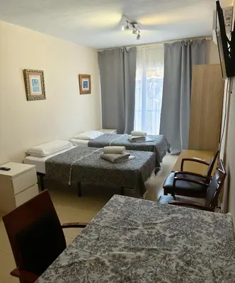 Cama o camas de una habitación en Royal Inn Aparthotel