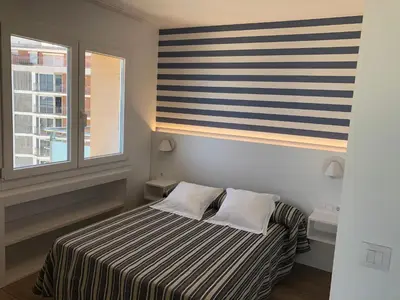 Cama o camas de una habitación en Apartaments Primera Linea Torre Valentina