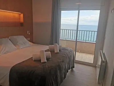 Cama o camas de una habitación en Apartaments Primera Linea Torre Valentina