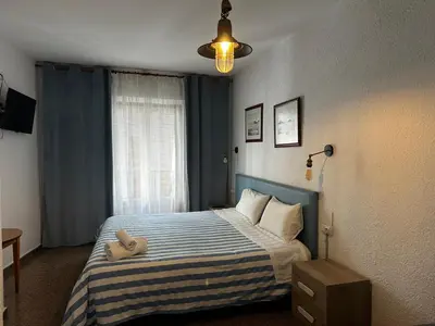 Cama o camas de una habitación en P&R hostals Maria Rosa