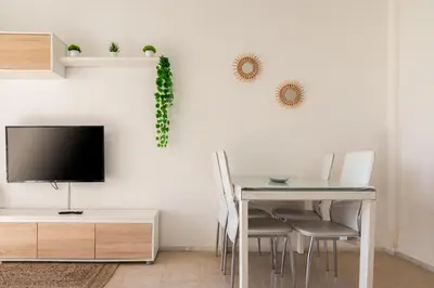 Una televisión o centro de entretenimiento en Apartamento Consul Park