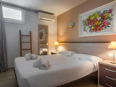 Cama o camas de una habitación en Playa Canadell MAR P primera línea de mar con terraza - WeHost Costa Brava