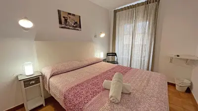 Cama o camas de una habitación en Hostal La Premsa