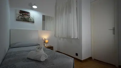 Cama o camas de una habitación en Hostal La Premsa