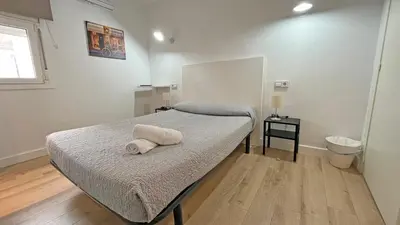 Cama o camas de una habitación en Hostal La Premsa