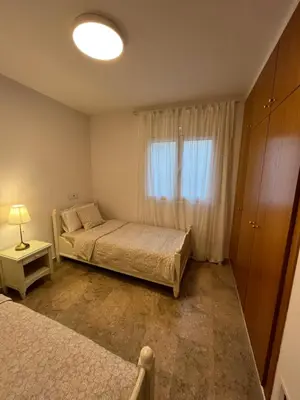 Cama o camas de una habitación en Apartamento luminoso Paloma a 350 metros de la playa con parking gratuito