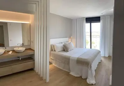 Cama o camas de una habitación en Calma S'Alguer Luxury Beach Apartment