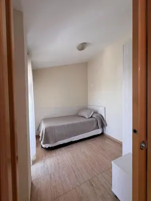 Cama o camas de una habitación en APCOSTAS Villa de Madrid