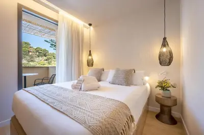 Cama o camas de una habitación en Talaia Plaza EcoResort Begur