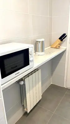 Una cocina o zona de cocina en Modern apartment with parking 2 min from the beach