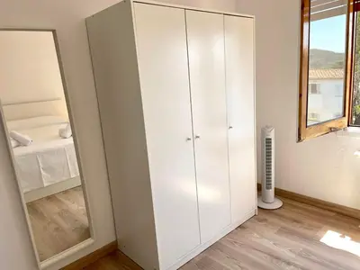 Cama o camas de una habitación en Modern apartment with parking 2 min from the beach