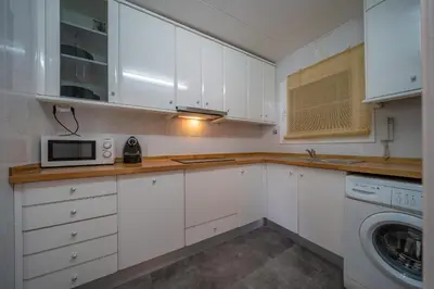 Una cocina o zona de cocina en HomeHolidaysRentals Eiffel - Costa Barcelona