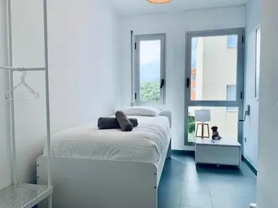 Cama o camas de una habitación en Hauzify I Apartament Fortuny