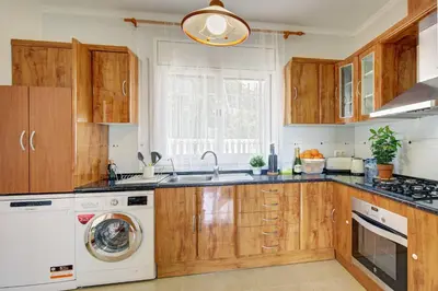 Una cocina o zona de cocina en VILLA ROSES with swimming pool & mountain view