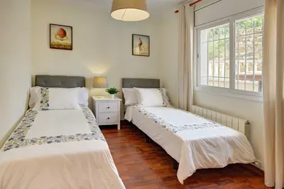 Cama o camas de una habitación en VILLA ROSES with swimming pool & mountain view