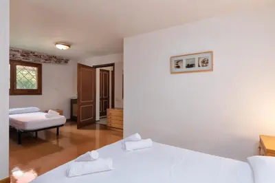 Cama o camas de una habitación en Hauzify I Casa Suredes