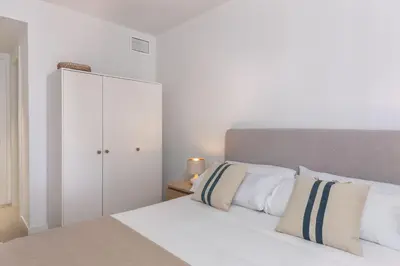 Cama o camas de una habitación en Flateli Sant Antoni 3