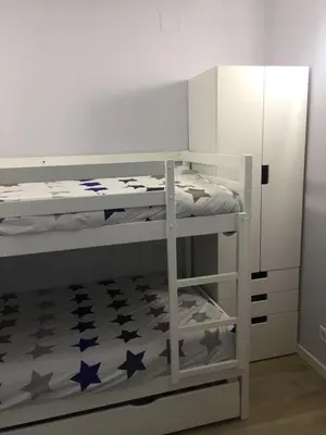 Cama o camas de una habitación en Apartamento a 50 mts playa con piscina en Blanes muy céntrico y acogedor.