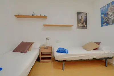 Cama o camas de una habitación en Rentalsbcn - Volantí