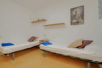 Cama o camas de una habitación en Rentalsbcn - Volantí