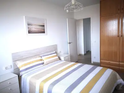 Cama o camas de una habitación en ÁTICO FRENTE AL MAR