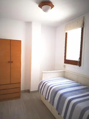 Cama o camas de una habitación en ÁTICO FRENTE AL MAR