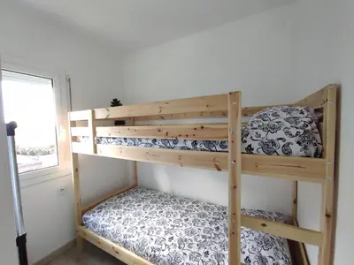 Cama o camas de una habitación en Aiguaneu Es Mediterrani