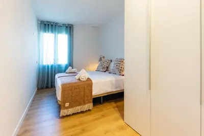 Cama o camas de una habitación en Bravissimo Tarlà, 2-bedroom apartment