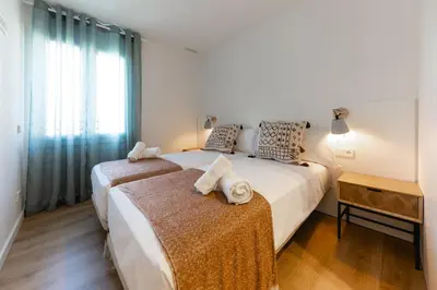 Cama o camas de una habitación en Bravissimo Tarlà, 2-bedroom apartment