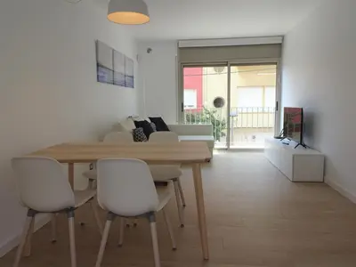 Una televisión o centro de entretenimiento en Precioso apartamento familiar con aparcamiento