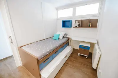 Cama o camas de una habitación en Apartamento exclusivo en primera línea de mar