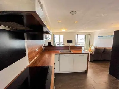 Una cocina o zona de cocina en Apartamento exclusivo en primera línea de mar