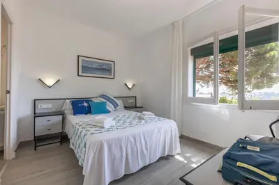 Cama o camas de una habitación en Bravissimo Vil·les Brusi C S'Agaró