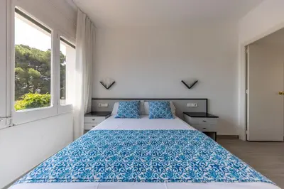 Cama o camas de una habitación en Bravissimo Vil·les Brusi C S'Agaró