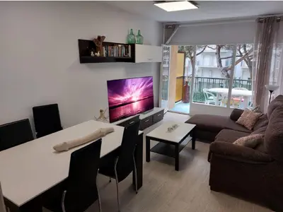 Una televisión o centro de entretenimiento en BRAVAHOLIDAYS-282-Palmeras-2