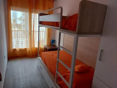 Cama o camas de una habitación en BRAVAHOLIDAYS-282-Palmeras-2
