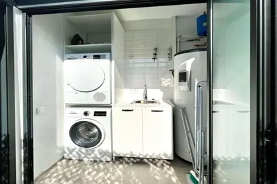 Una cocina o zona de cocina en Hauzify I Apartaments Sant Pau