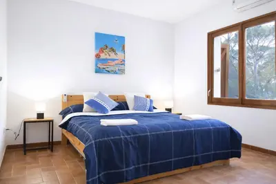 Cama o camas de una habitación en Villa Can Raurell · Casa rural para 14 en Girona