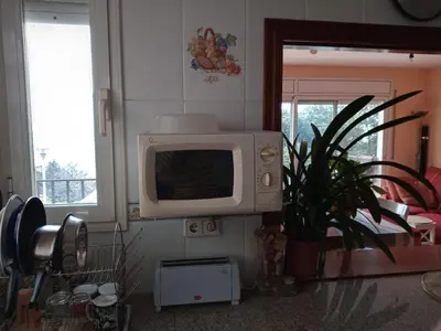 Una televisión o centro de entretenimiento en Pis a Blanes amb precioses vistes al mar.