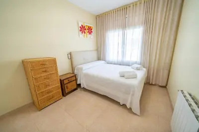 Cama o camas de una habitación en HomeHolidaysRentals Dona - Costa Barcelona
