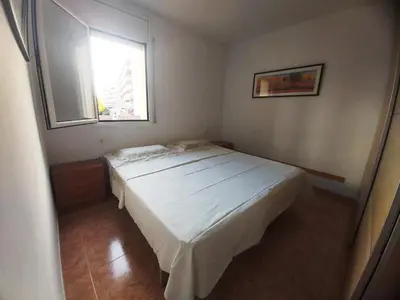 Cama o camas de una habitación en APARTAMENTO A PIE DE LA PLAYA