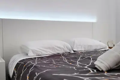 Cama o camas de una habitación en Acogedor apartamento en el corazón de Calella, a solo 2 minutos de la playa