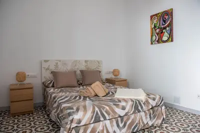 Cama o camas de una habitación en Hauzify I Apartament Can Missé
