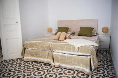 Cama o camas de una habitación en Hauzify I Apartament Can Missé