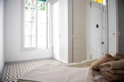 Cama o camas de una habitación en Hauzify I Apartament Can Missé