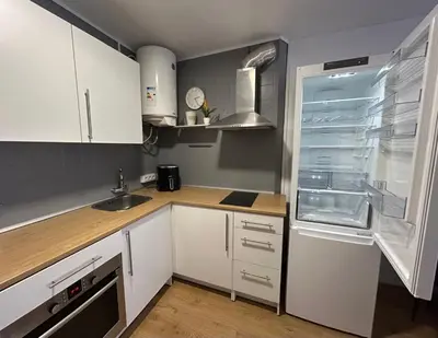 Una cocina o zona de cocina en Fantástico piso con piscina en corazón de Fenals