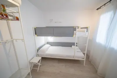 Cama o camas de una habitación en HomeHolidaysRentals Beach - Costa Barcelona