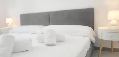 Cama o camas de una habitación en Precioso Apartamento Reformado en 1ra Linea de Mar sin vistas