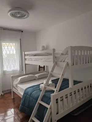 Cama o camas de una habitación en Apartament familiar tranquil a Platja d'Aro